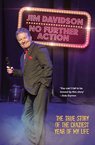 Jim Davidson holding a microphone in front of a lit marquee sign on stage.