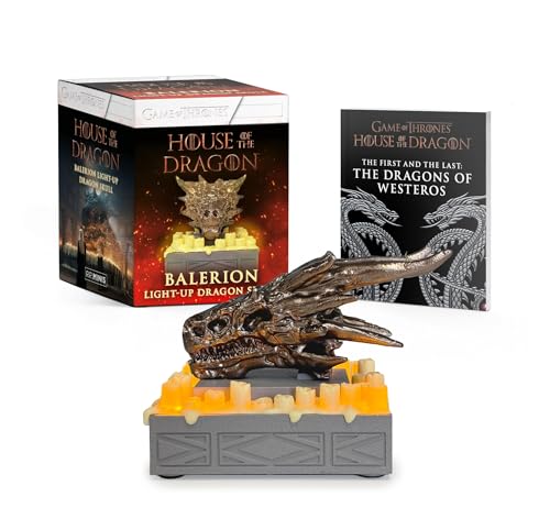 Bronze dragon skull with illuminated base, packaged with a book.