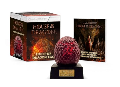 Red, scaled dragon egg on a black base with accompanying book and box.