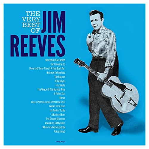 Jim Reeves standing and holding an acoustic guitar on a bright blue background.
