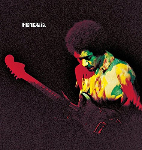 Jimi Hendrix playing an electric guitar against a dark, textured background with colorful lighting.