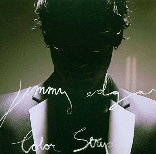 Jimmy Edgar’s “Color Strip” CD cover: a shadowed face with glowing eyes.
