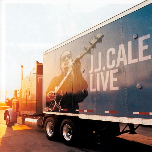 A semi-truck with a picture of J.J. Cale playing guitar on its side.