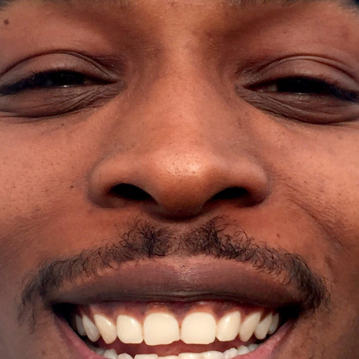 Vinyl record cover featuring a minimalist black and white portrait of Jme.