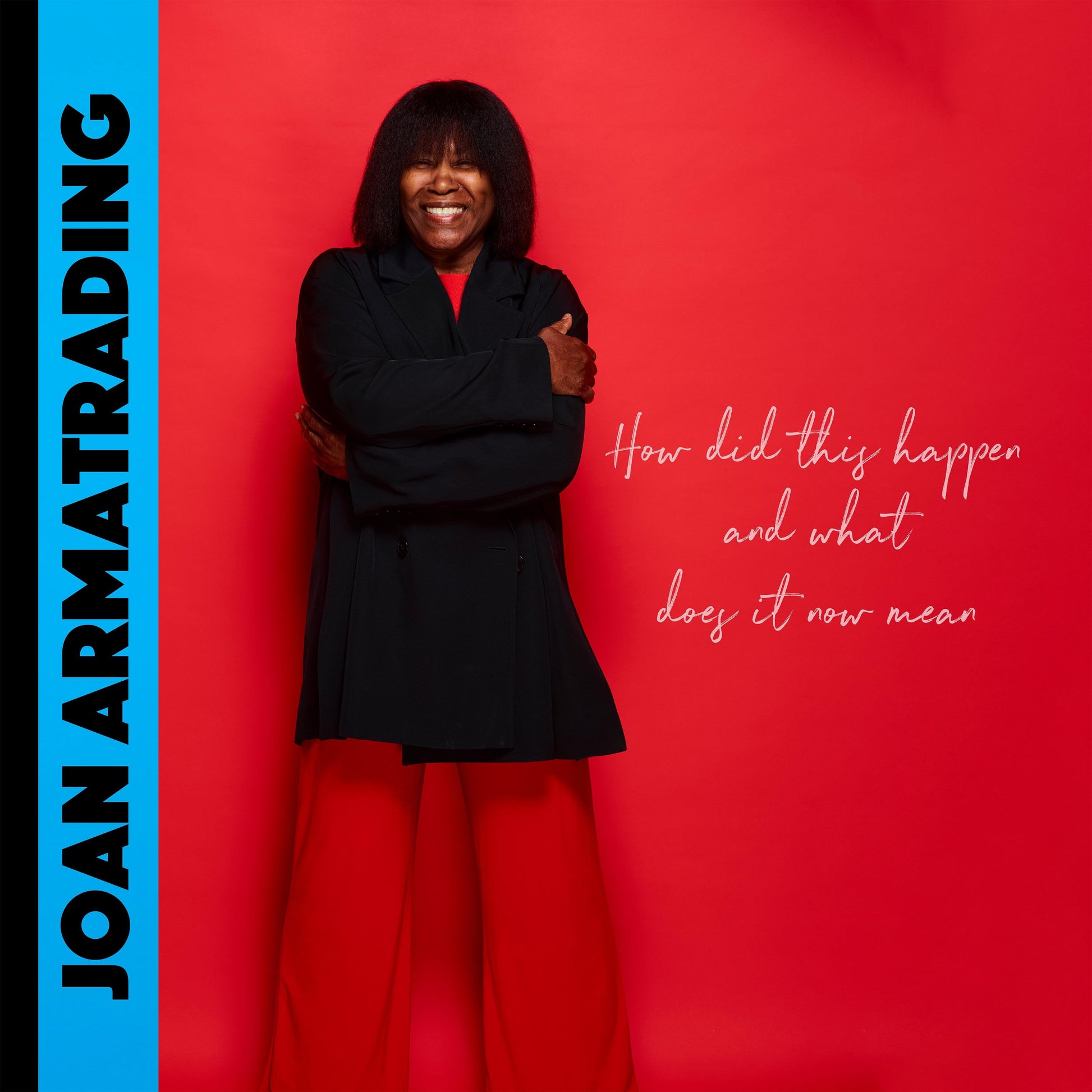 Joan Armatrading album cover, red background, portrait of a smiling woman.