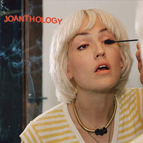Close-up of a blonde woman applying mascara, album cover for Joanthology.
