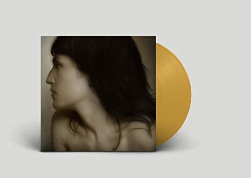 Vinyl record with cover featuring a portrait of a woman in profile.