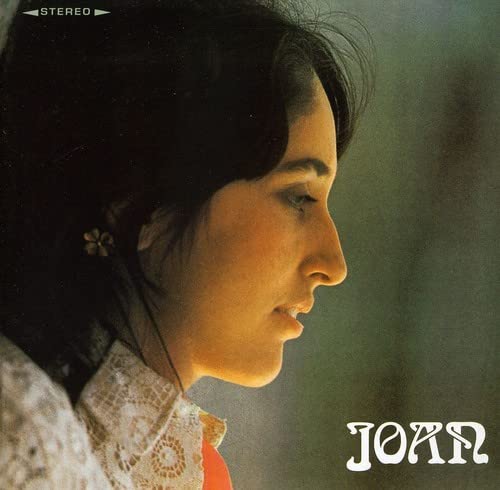 Profile portrait of Joan Baez with dark hair and a white lace collar.