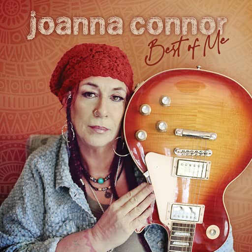 Joanna Connor album cover featuring a woman with a red hat and guitar.