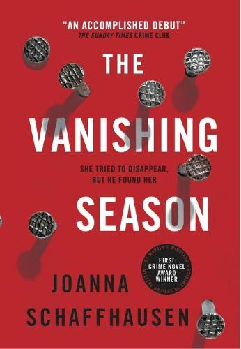 Red book cover with white title "The Vanishing Season" and scattered metal pins.