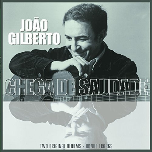 "Black and white album cover featuring a man holding a guitar, with text overlay."