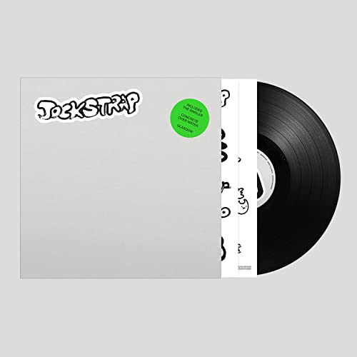 Vinyl record with white album cover featuring black script and a green sticker.