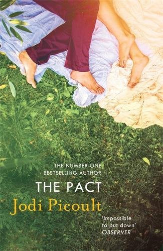 Book cover: feet on a blanket in green grass, title "The Pact".