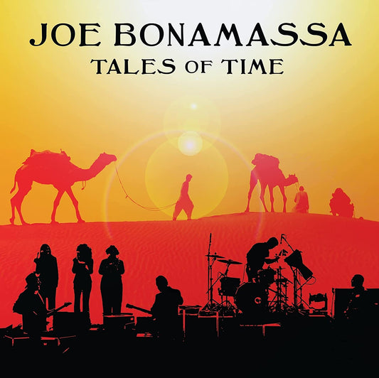 "Album cover with desert scene and musicians, titled 'Joe Bonamassa Tales of Time'."