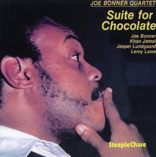 "Album cover featuring a man with hand on chin, contemplative expression, against a dark background."