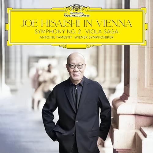 Album cover featuring composer Joe Hisaishi in front of a building.