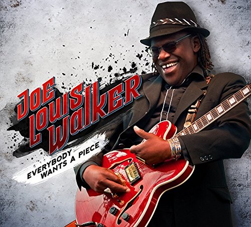 Joe Louis Walker smiling, playing a red electric guitar.
