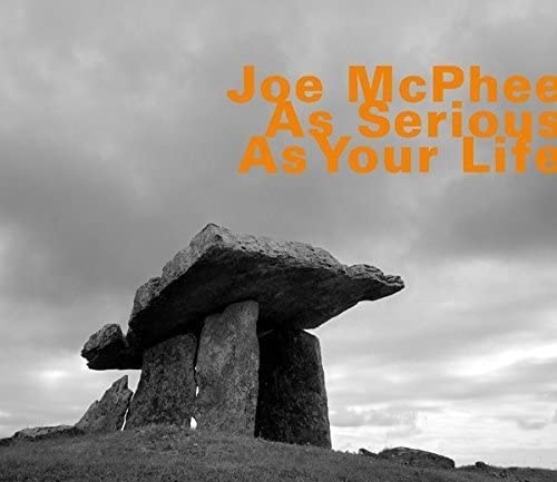 CD cover for Joe McPhee’s “As Serious As Your Life” with stone monument.