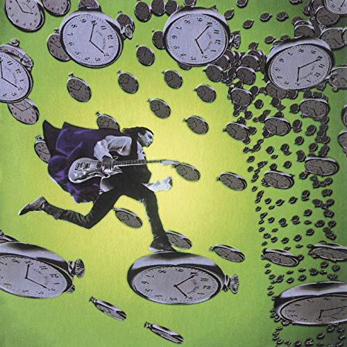Man with guitar running amidst falling pocket watches on green.
