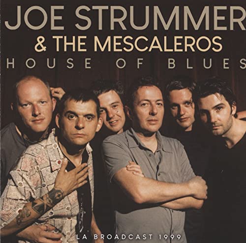 Joe Strummer and The Mescaleros band members posing for their House of Blues album cover.