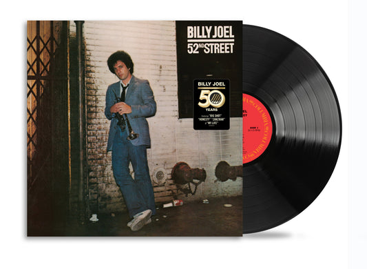 Billy Joel’s “52nd Street” vinyl record with album cover and black disc.
