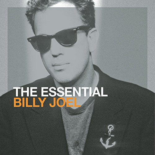 Black and white portrait of Billy Joel wearing sunglasses with album title text overlay.