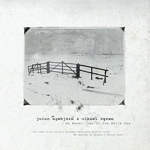 Black and white CD cover with a snowy landscape and wooden fence.