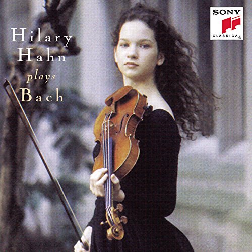 Hilary Hahn holding a violin, album cover for Bach’s music.