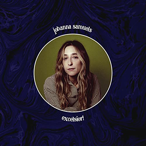 "Album cover with a woman's portrait on a dark blue marbled background."