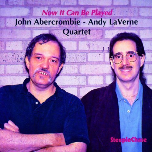 "CD cover with two men standing in front of a brick wall."