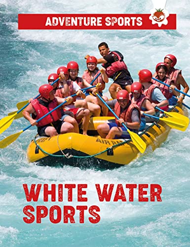 Rafting team paddling through turbulent, whitewater rapids wearing life vests and helmets.