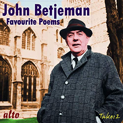John Betjeman in a hat and coat, standing before a church.