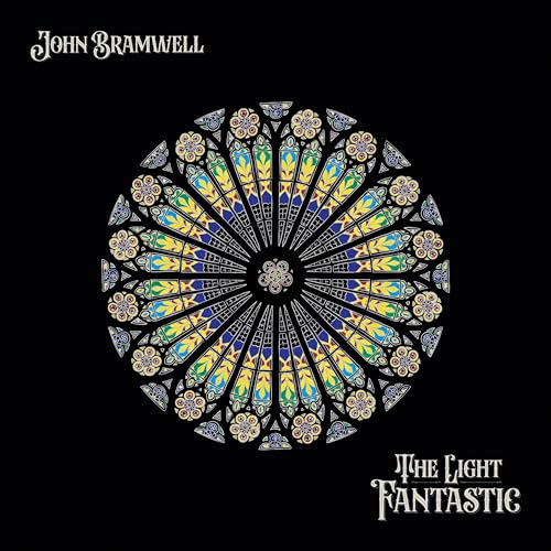 Album cover featuring a colorful circular stained-glass rose window against a black background.