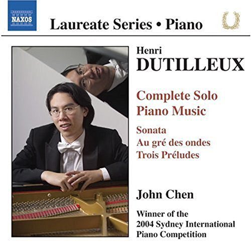 "CD cover featuring a man in a tuxedo playing a piano."