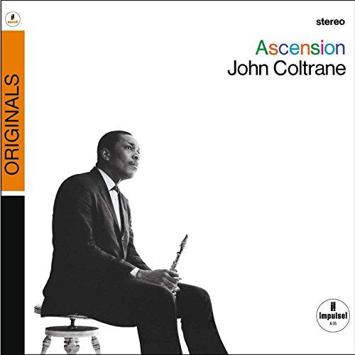 John Coltrane in a suit holding a saxophone, against a white background.