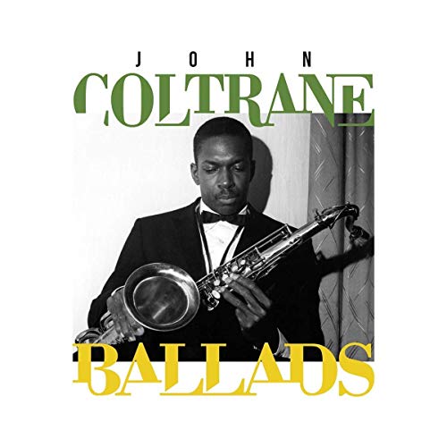 John Coltrane album cover, black and white portrait with saxophone.