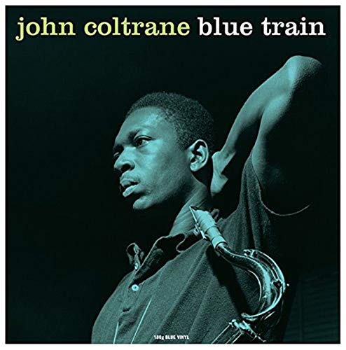 John Coltrane’s “Blue Train” album cover featuring a portrait with saxophone.