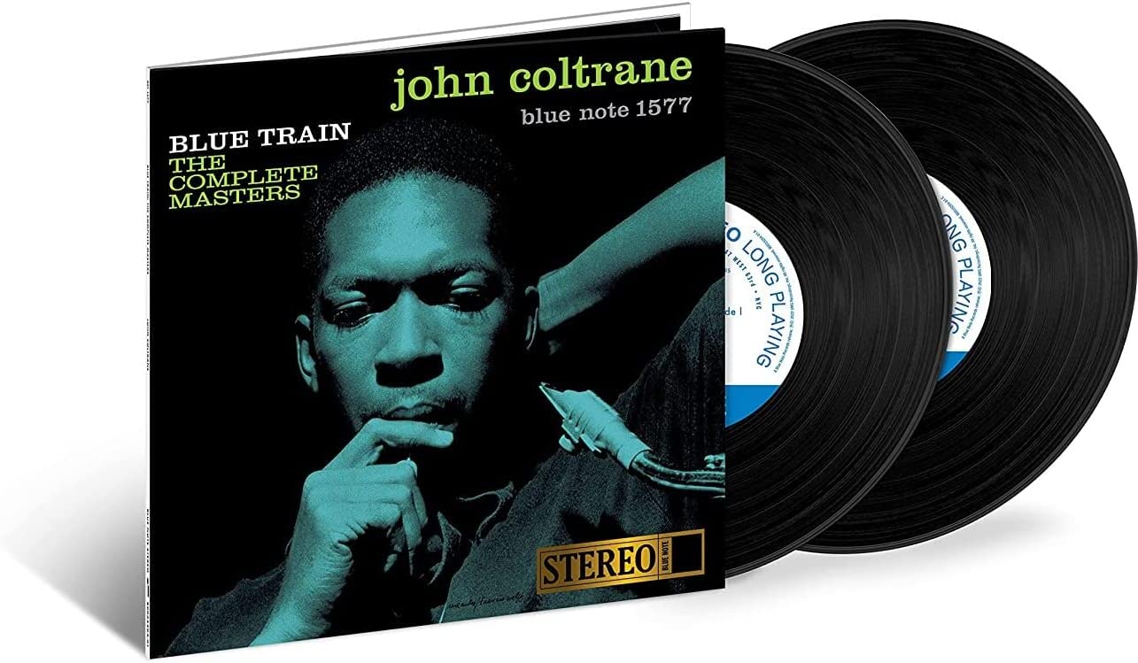 Blue-tinted album cover featuring John Coltrane holding a saxophone with contemplative expression.