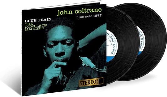 Blue-tinted album cover featuring John Coltrane holding a saxophone with contemplative expression.