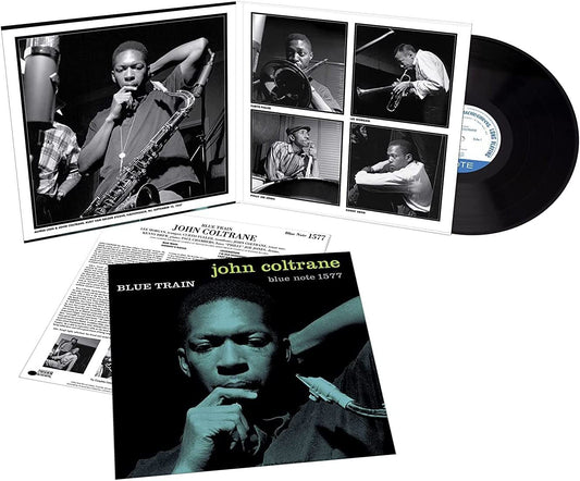 "Black vinyl record with cover featuring a man in contemplative pose, partially visible behind."