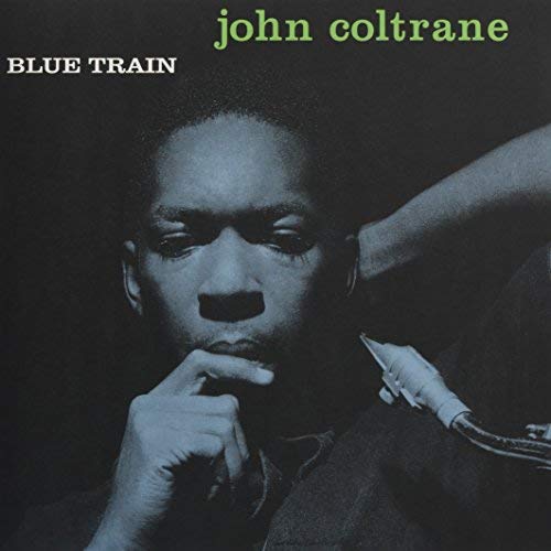 John Coltrane’s “Blue Train” album cover, portrait of a man with saxophone.