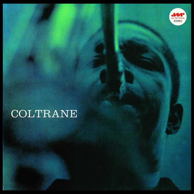 Close-up portrait of John Coltrane on a red and green vinyl record cover.