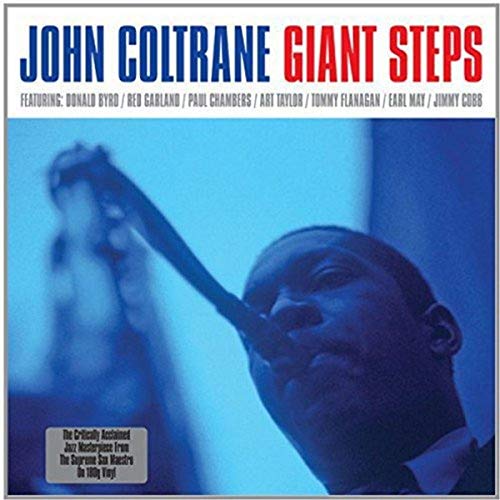 John Coltrane's "Giant Steps" album cover with a blue-toned portrait.