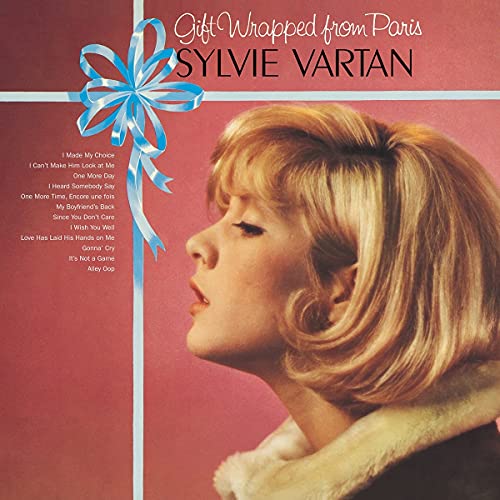 Album cover featuring Sylvie Vartan on a red background with a blue gift ribbon.