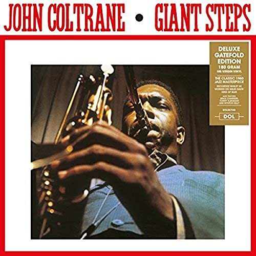 John Coltrane playing a saxophone on the album cover, "Giant Steps.