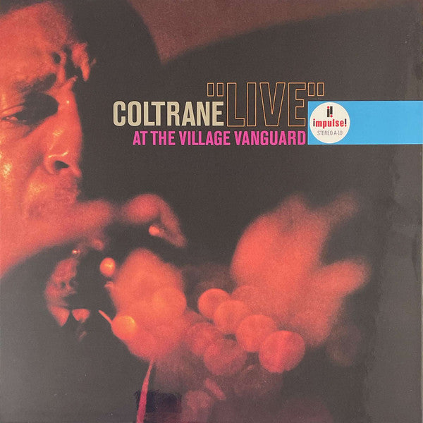 John Coltrane album cover, featuring a red and black abstract portrait.