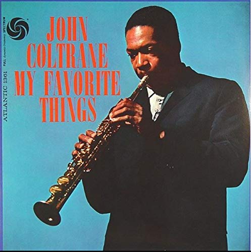 John Coltrane playing a soprano saxophone against a blue background on an album cover.