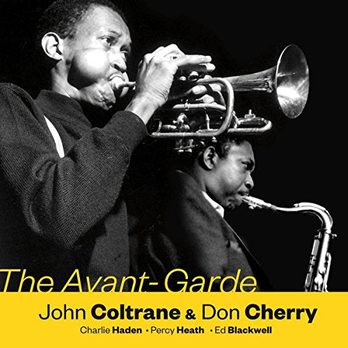 Black and white photo of John Coltrane and Don Cherry playing instruments.
