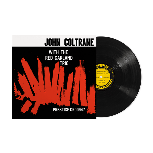 John Coltrane vinyl record with black cover and red abstract design.