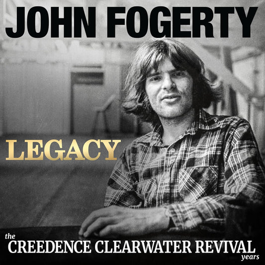 Black and white portrait of John Fogerty wearing a plaid shirt on album cover.